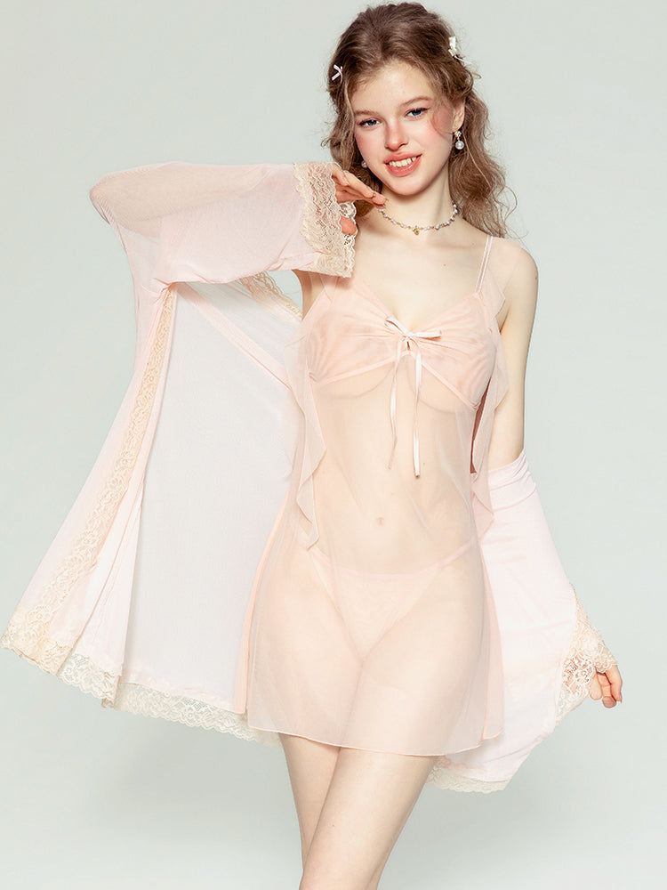 Woman wearing a light pink dress with sheer sleeves against a white background sheer mesh babydoll dress, slip dress, see through lingerie, transparent lingerie, mesh dress, sleep dress, lingerie dress.