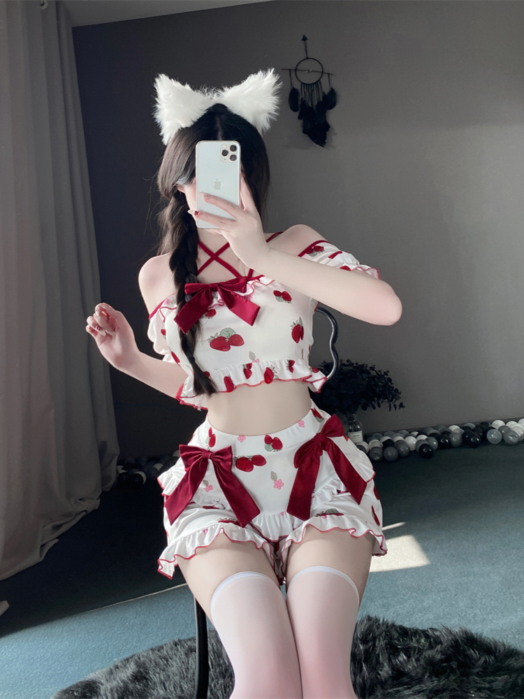 Front view of the strawberry-print two-piece dress with off-shoulder top, red bow accents, and layered ruffle skirt, styled with white thigh-high stockings.