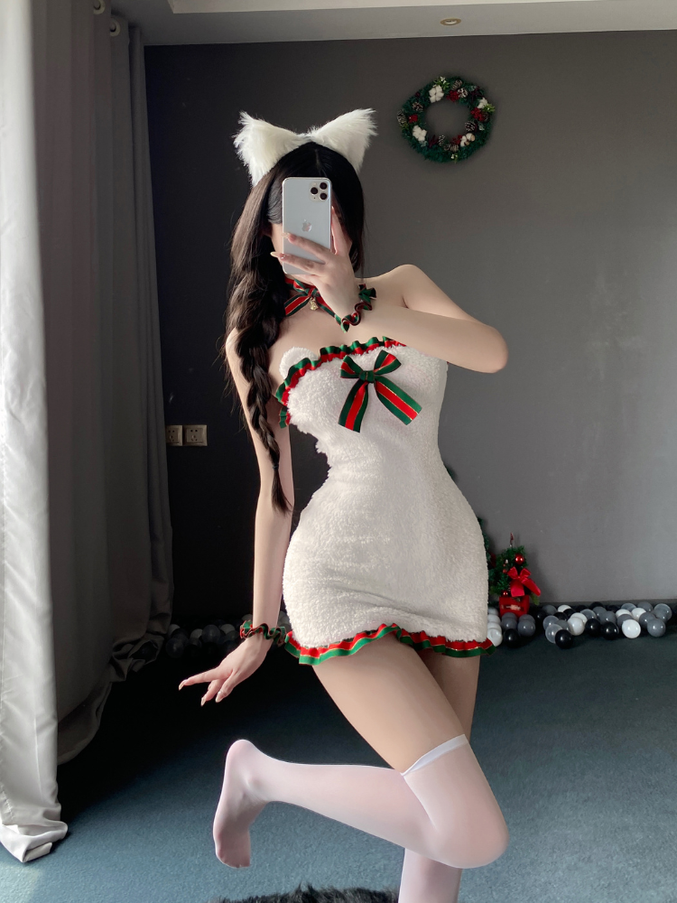 holiday mini dress featuring halter neckline and festive bow accents