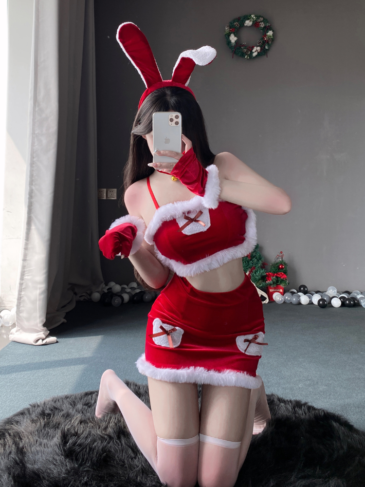 Festive bunny costume set with a furry-trimmed top, mini skirt, and bow accents, styled with matching accessories including a choker and gloves.