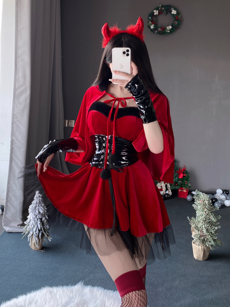  Christmas themed red dress featuring a detachable hooded cape, layered tulle skirt, and corset belt, captured in a holiday backdrop