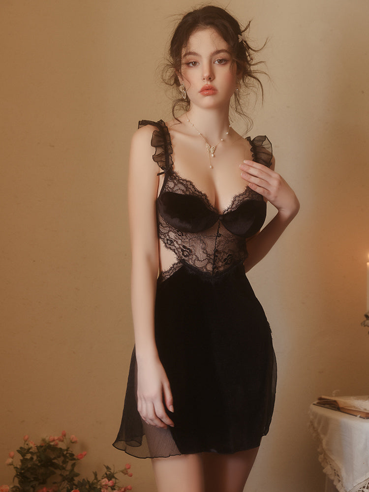Woman wearing a black Lace Corset Bodice Velvet Slip Dress against a warm-toned background
