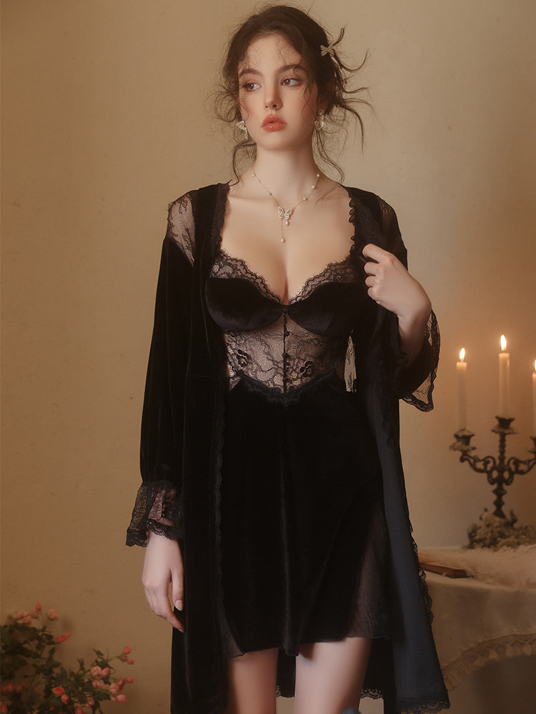 Woman wearing a black Lace Corset Bodice Velvet Slip Dress with a robe in a warm-toned room.