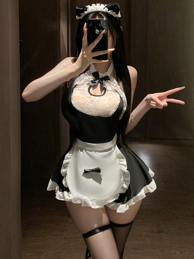 Person wearing a black and white Sexy French Maid Outfit Lace Halter Apron Mini Dress with a bow tie and apron.
