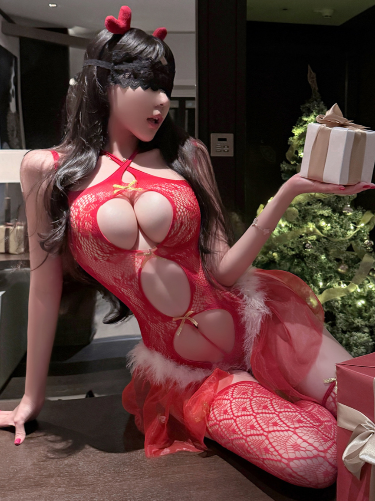 Person in a Sexy Red Lace Christmas Lingerie Set with Feather Trim holding a gift box.