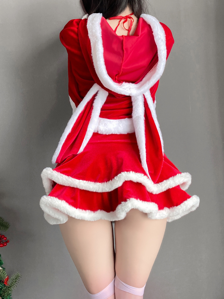 Back view of a Christmas costume dress with detachable hooded cape and fur trim, styled for a festive event