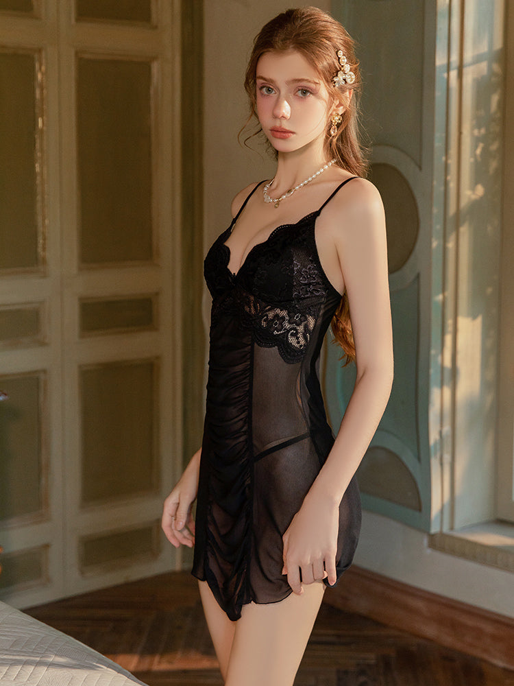 Woman wearing a black Ruched Lace Sheer Babydoll Nightgown in a softly lit room.