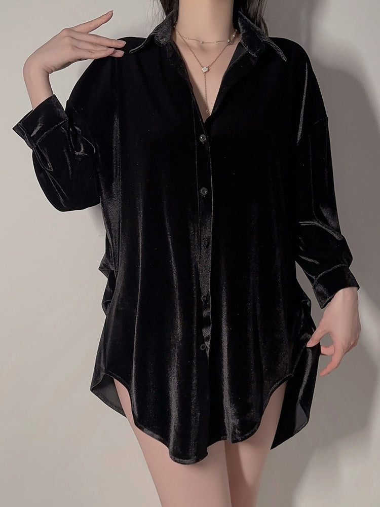 Model standing wearing black velvet button down shirt dress front view