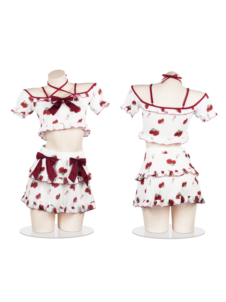 Full display of the strawberry-print two-piece dress set with bow details, shown on a mannequin, highlighting the layered ruffle design and elastic waistband.