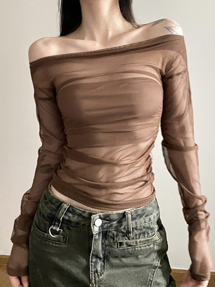 Brown off-shoulder top worn by a person against a neutral background
