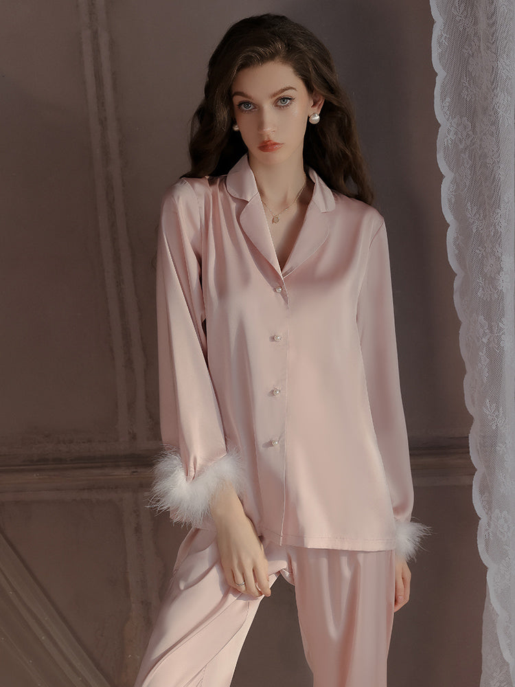 Pink Feather Cuff Satin Pajama Set with a button front top and matching pants, showcasing a relaxed fit and luxurious satin material.