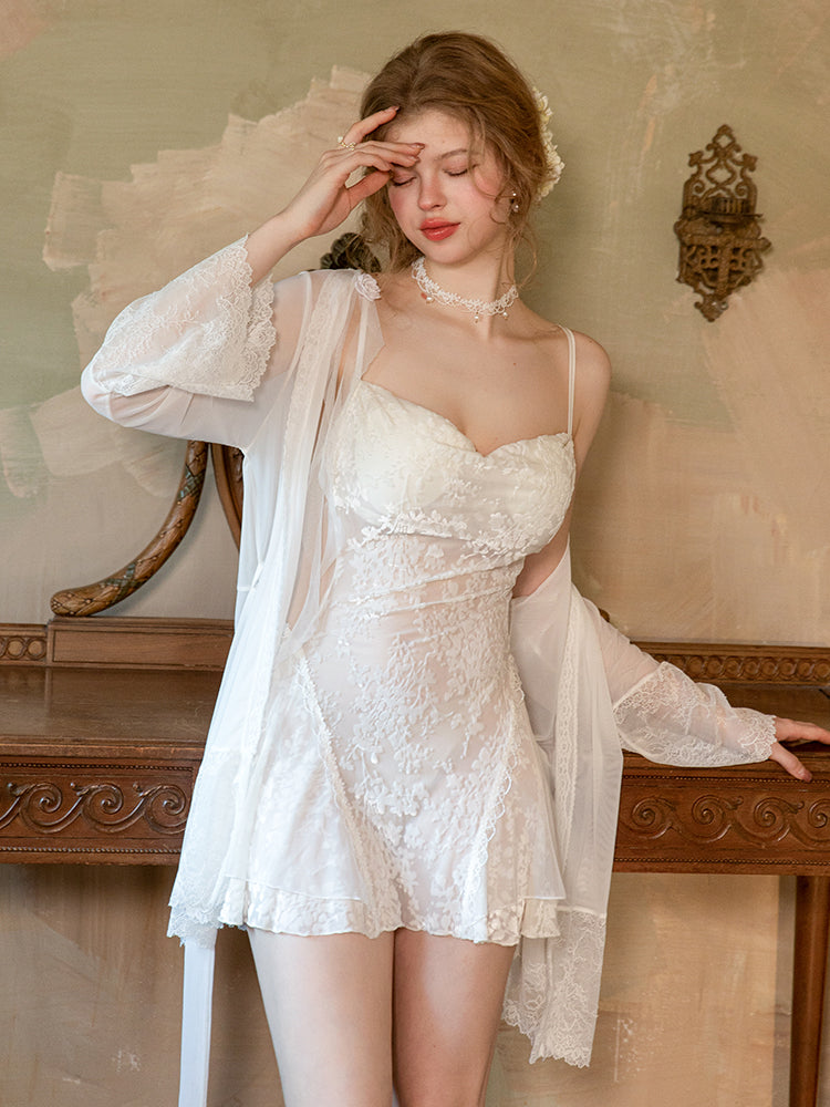 Woman in a white lace nightgown standing in a vintage room. white babydoll dress, mini dress, floral embroidered dress, sheer lingerie, white lingerie, chemise nightgown, mini slip dress