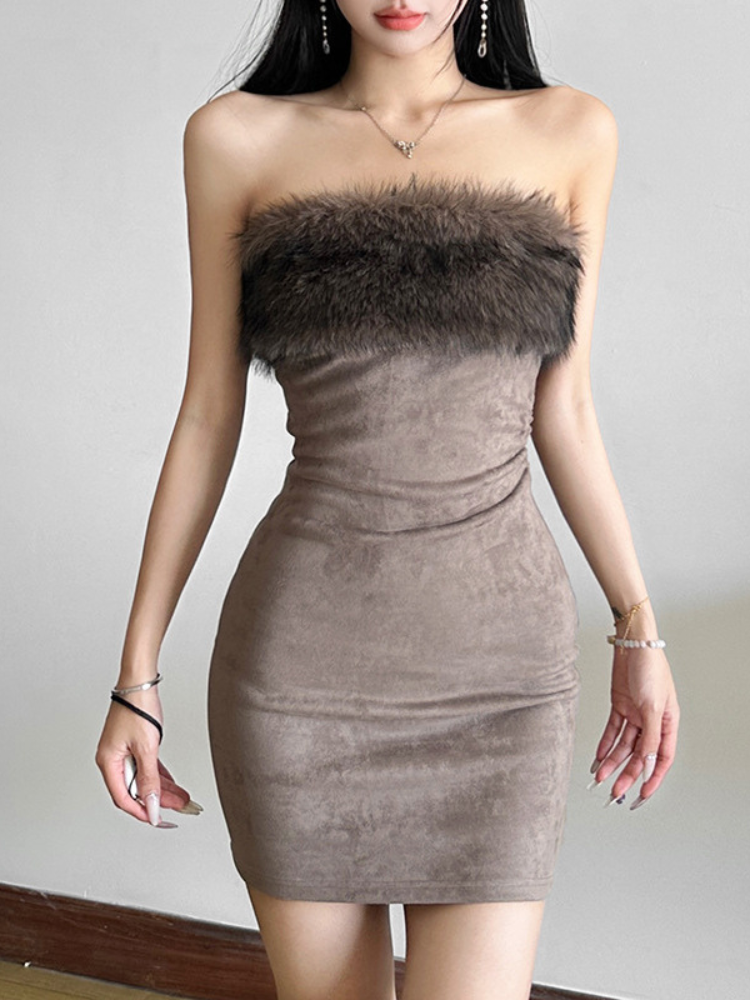 Front angle of a strapless velvet dress with fluffy trim, highlighting its sleek design