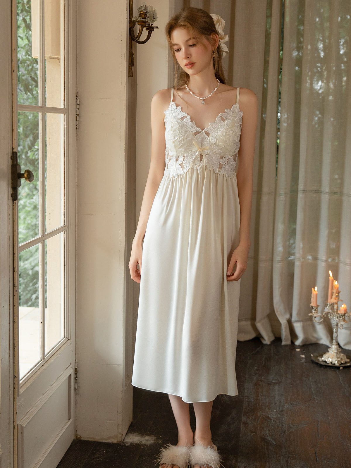 White sleeveless satin midi slip dress full front view showing loose skirt and lace bodice
