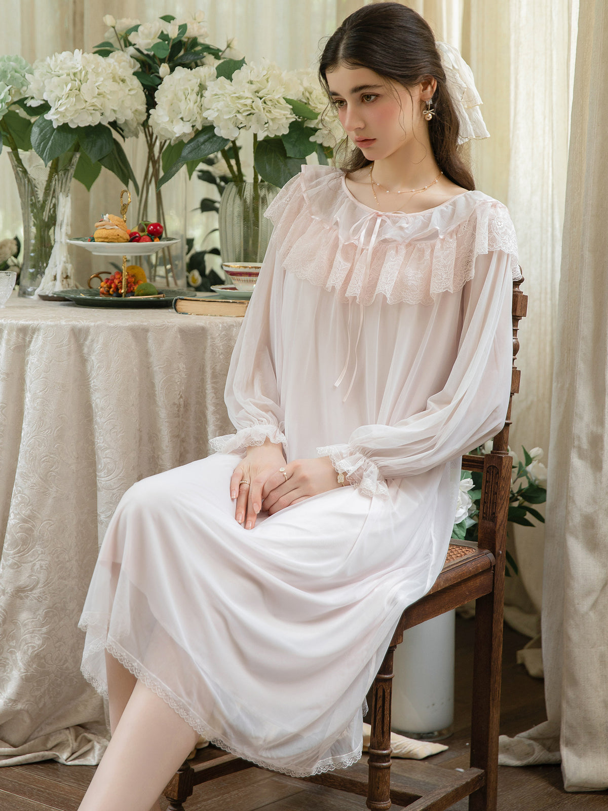 Pink ruffle cuff layered mesh nightgown seated front view