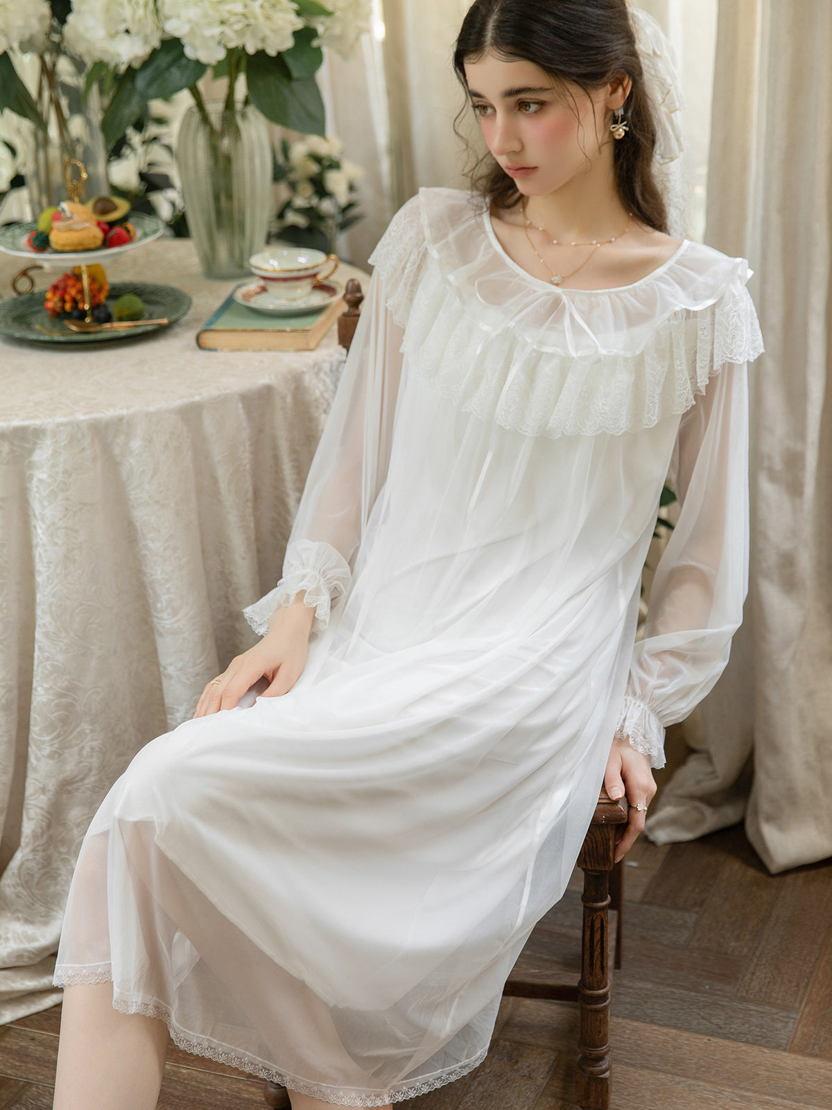 Ivory sheer mesh ruffle yoke nightgown seated front view