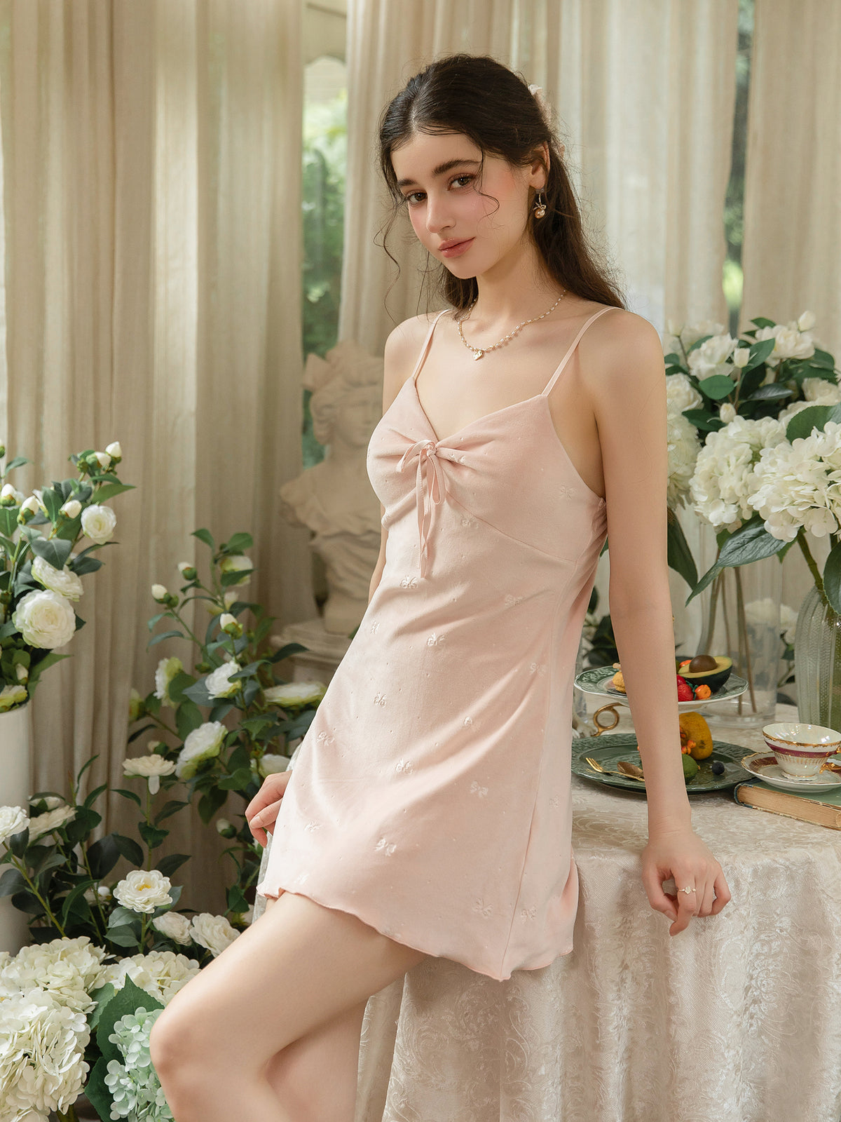 Pink center tie bow print mini nightdress angled front view